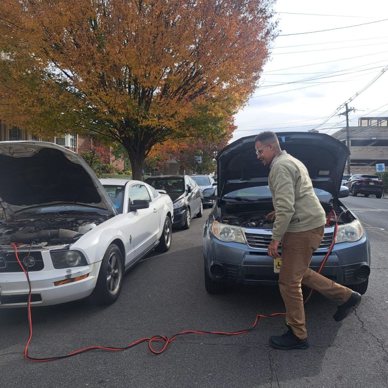 Happy road services tech doing a battery Jump start in kearny NJ 