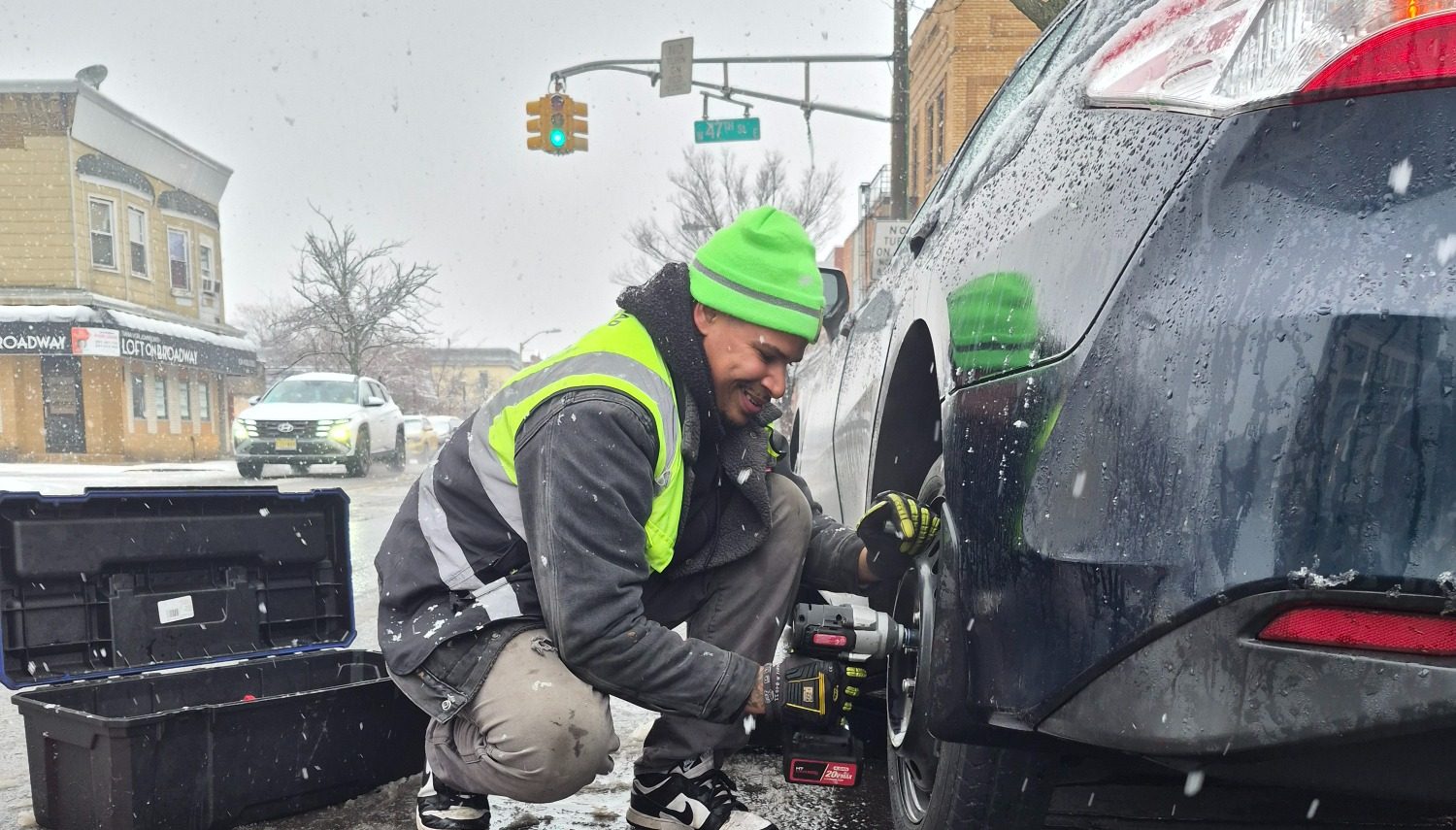 Happy Road Services Roadside assistance in Bayonne NJ, Doing a Tire Change 
