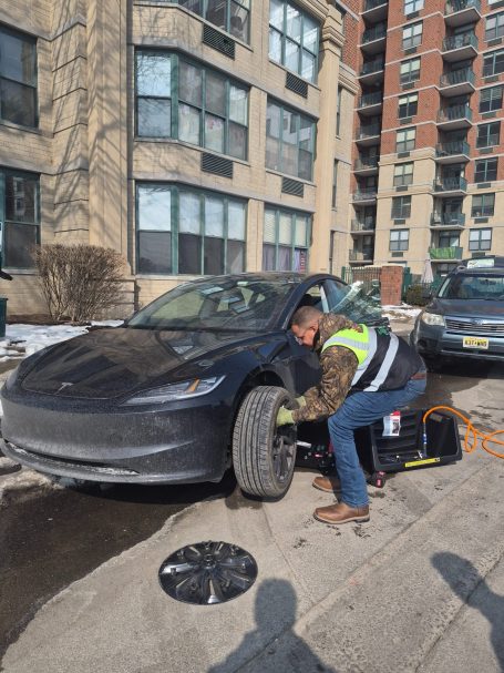 Happy road services performing a Tire Change / Tire Repair  In Weehawken NJ  , Also Serving Entire Hudson county 