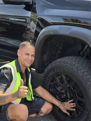 tire repair in weehawken NJ tire repair in weehawken NJ on a Chevy Colorado Luis with a thumbs up