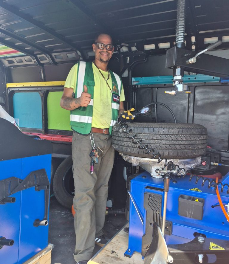 Tire Replacement By happy road services in NJ replacing and installing a new tire on a Mercedes Benz in Bayonne NJ