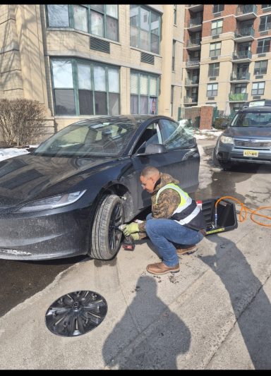 Roadside assistance in hoboken  NJ fixing flat tire and helping driver