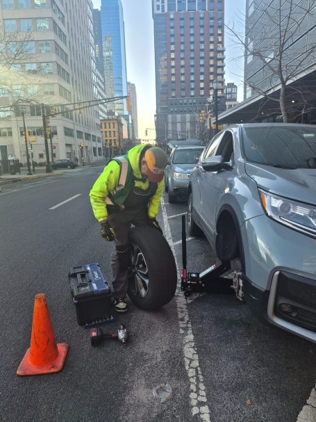 Roadside Assistance Performing a Tire repair / Tire change in jersey city NJ , Hudson County 
