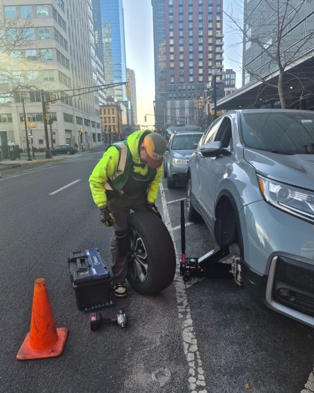 roadside tire repair service fixing punctured tire