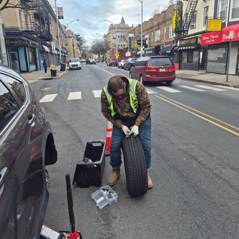 Roadside assistance tire change in Union City NJ by Happy Road Services
