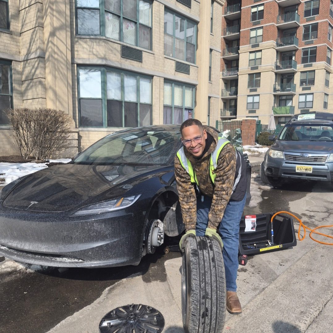  happy road services doing a Tire Change in Hoboken NJ, Hudson county