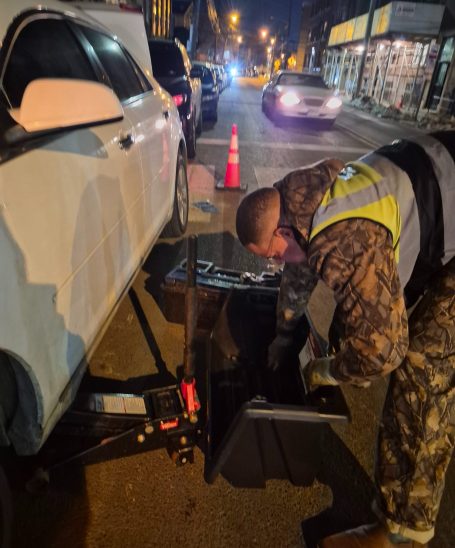 flat tire roadside assistance service changing tire